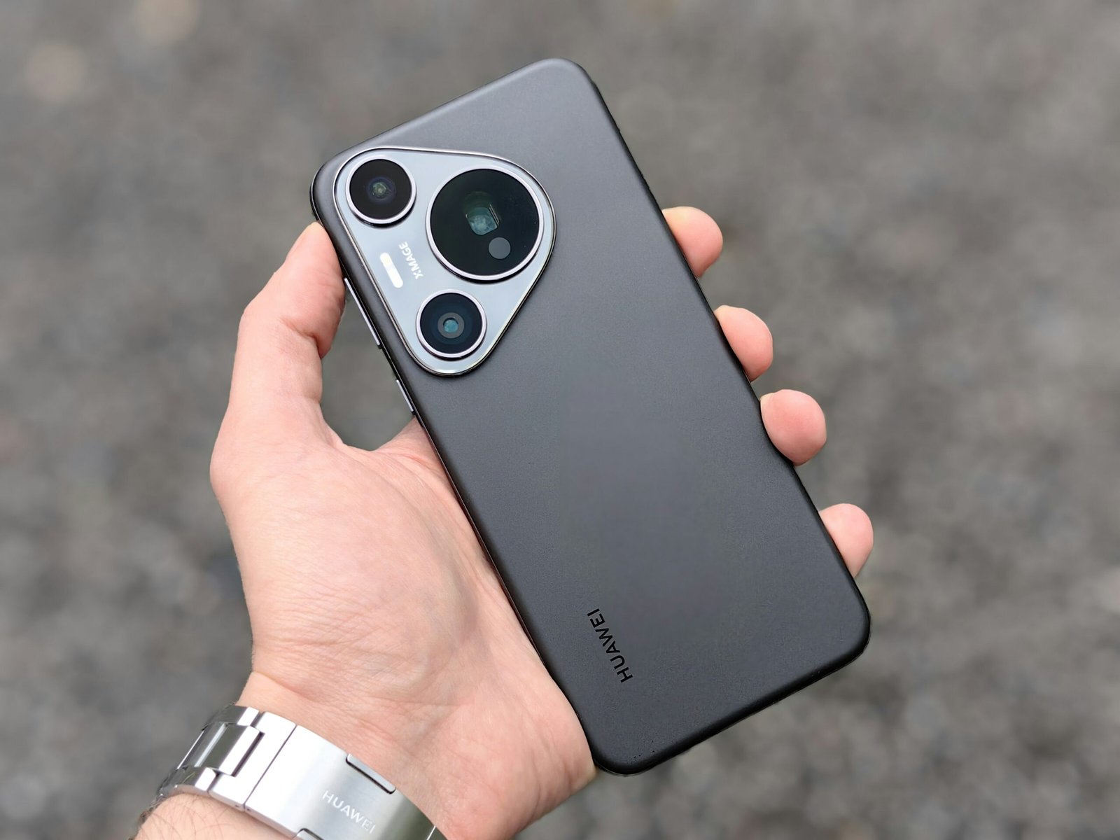 A person holding a cell phone in their hand